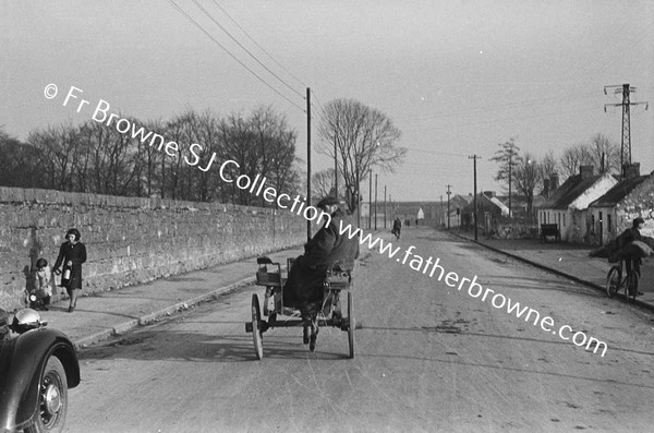 OUTSKIRTS OF TOWN WITH HORSE AND CART